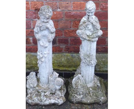 A pair of precast garden pedestals with pixies playing instruments Condition reports not available for this auction