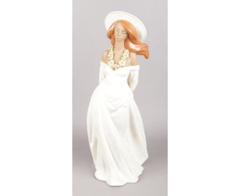 A large Lladro sunset model number 2046 'Dawn', of a girl with floral necklace.  Good condition.