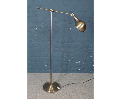 A brass adjustable reading lamp.  