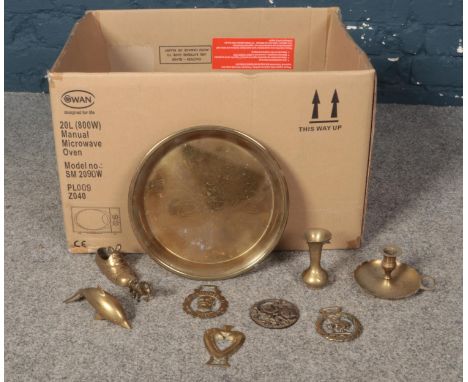 A box of assorted brasswares. Horse brasses, bud vase, candlestick etc.  