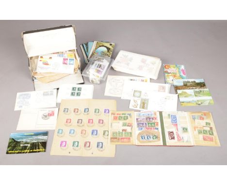 A quantity of first day cover stamps, postcards and used stamps. To include Third Reich Nazi German postage stamps bearing th