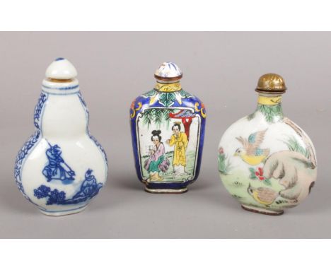 Three oriental scent bottles. Including enamelled example, ceramic blue &amp; white example depicting figures, etc.  