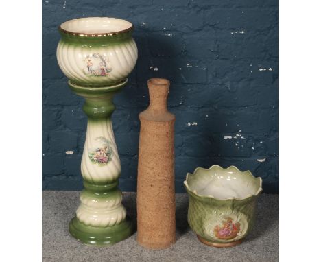 A large ceramic jardinière plant stand, with similar plant pot and large stone vase.  