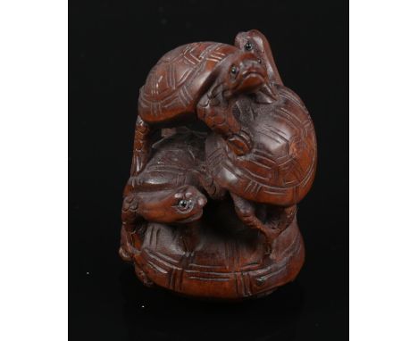 A carved hardwood Chinese netsuke. A quantity of turtle on top of each other. 5cm height.  