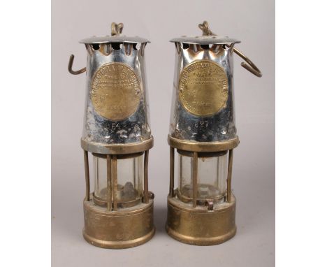 A pair of  'The Protector Lamp &amp; Lighting Co. Ltd'  safety miner's lamps by Eccles, both type 6 (No 654 &amp; 627) H:23cm
