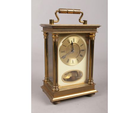 A West German brass carriage clock. Movement stamped SSS, chiming on a bell.  