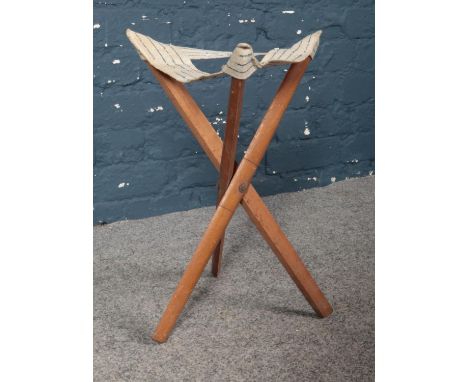 A vintage wooden folding tripod canvas camp/fishing stool. H: 45cm.  