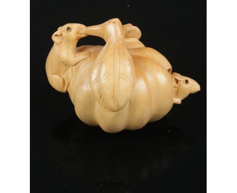 A carved hardwood Chinese netsuke. Two rats on a pumpkin. 5cm height.  
