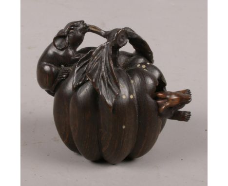 A carved hardwood Chinese netsuke. Two Rats on a pumpkin. 5cm height.  