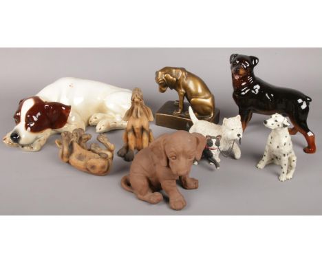 A quantity of dog figures. Including large Goebel ceramic recumbent example, cooper craft, etc.  