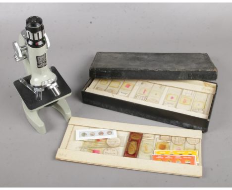 A Prinz Model 380L microscope and box of Histology slides.  