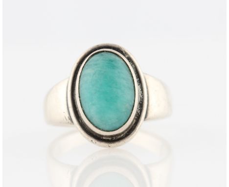 A Georg Jensen dress ring, set with a central oval green stone cabochon, design no. 46, stamped 925 S with makers mark, ring 