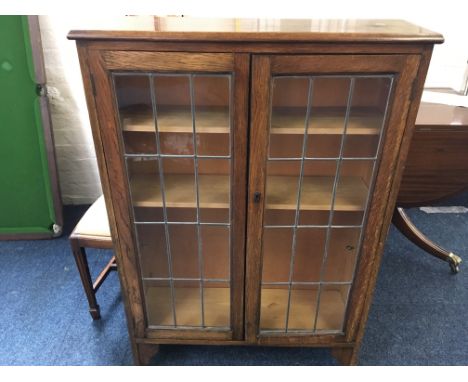 An oak two door glazed bookcase.