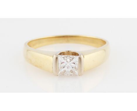 A diamond solitaire ring, set with a princess cut diamond, measuring 0.59ct, to raised shoulders, hallmark partially rubbed, 
