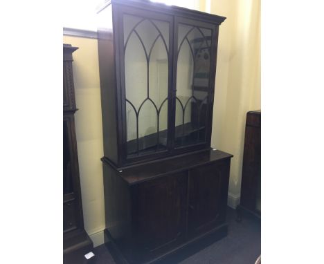 A 19th Century mahogany glazed two door cupboard bookcase.