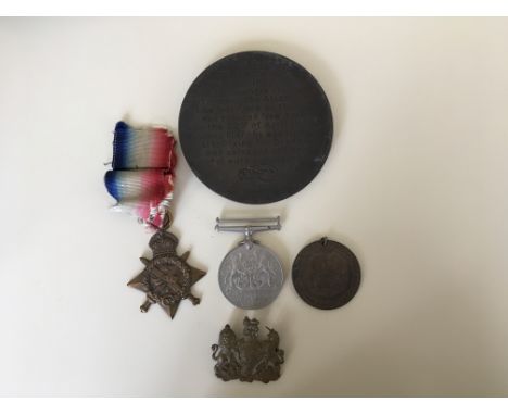 A collection of two medals from WW1 and WW2 together with a commemorative coin.