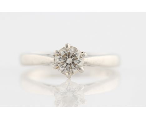 A platinum diamond solitaire ring, set with a round brilliant cut diamond, measuring approx. 0.50ct, hallmarked Birmingham, r