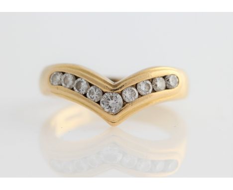 An 18ct yellow gold nine stone wishbone ring, channel set with nine graduated round brilliant cut diamonds, hallmarked Birmin