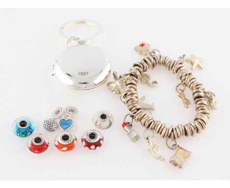 A collection of various jewellery to include a Links of London charm bracelet, a Links of London key ring, Pandora charms etc