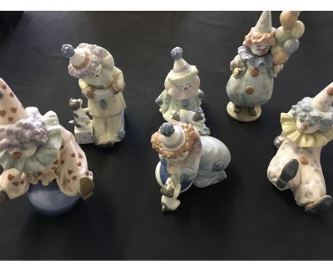 Six Lladro clown figures.
