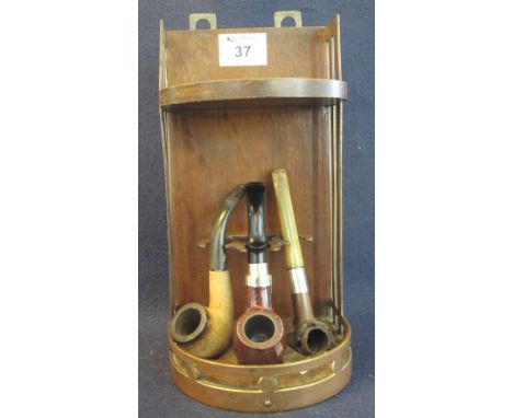 Mid century brass and mahogany hanging pipe stand in the style of Charles Rennie Mackintosh, together with three smoking pipe