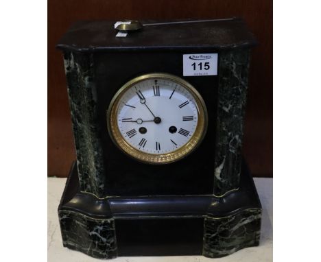 19th century black slate and veined marble, two train mantel clock with Roman enamel face and French brass drum movement. Inc