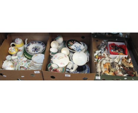 Two boxes of assorted china to include floral teaware, various cow creamers and china animals, coffee cans and saucers, plate