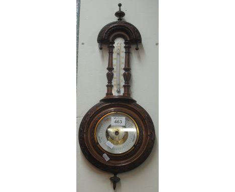 20th century walnut carved wall barometer.(B.P. 24% incl. VAT)
