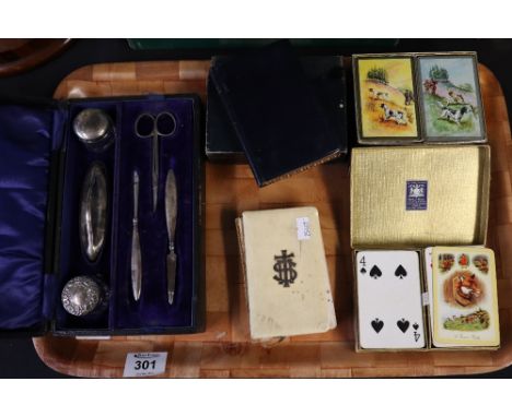 Various sets of playing cards, leather cased pair of prayer and hymn books, another prayer book, and a cased silver manicure 