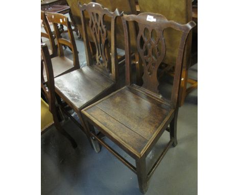 Two similar 19th century oak, Chippendale style farmhouse kitchen chairs. (2)