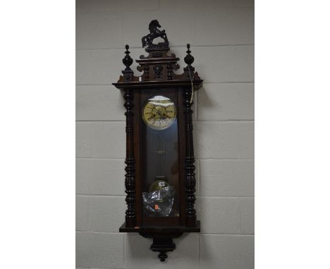 A LATE 19TH CENTURY WALNUT CASED VIENNA REGULATOR WALL CLOCK, horse surmount to pediment with turned finials and central fema