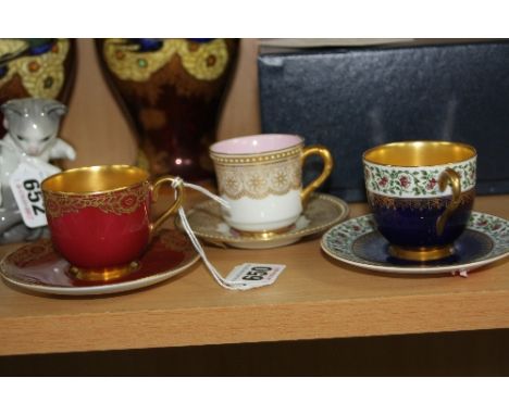 THREE VARIOUS ROYAL WORCESTER CABINET COFFEE CUPS AND SAUCERS, all with gilt detailing and two with gilt interior