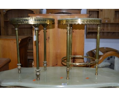 A BRASS FRAMED ONYX NEST OF TWO TABLES, two circular occasional tables, console table and spare onyx top (6)