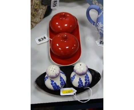 TWO CARLTONWARE CRUET SETS, 'Tomatoes' and another (holly Hocks)