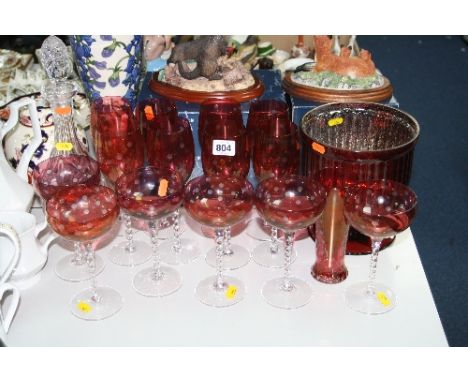 A SUITE OF RUBY COLOURED GLASSES (14), a cut glass decanter and two other glass items