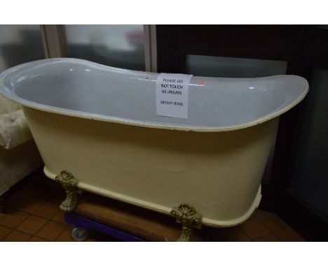A LATE 19TH CENTURY FRENCH CAST IRON BATEAU BATH, by Rogeat &amp; Cie of Lyon, (No 7), white enamel interior, on four short c