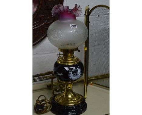 A BRASS OIL LAMP, with central reservoir and shade and three other various table lamps (4)