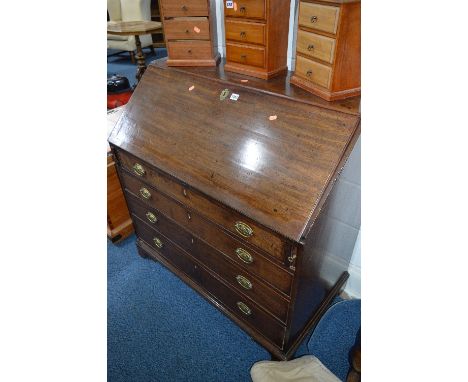 A GEORGIAN MAHOGANY WRITING BUREAU, with fall front, fitted interior above four exterior drawers with brass handles on bracke