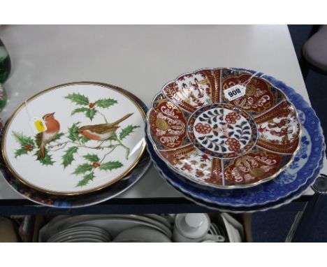 A PAIR ORIENTAL BLUE AND WHITE PLATES, diameter approximately 28cm and another modern Imari design plate, diameter 24.5cm, to