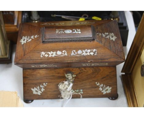 A MOTHER OF PEARL INLAID TEA CADDY, on four bun feet, length approximately 23cm (some dents)