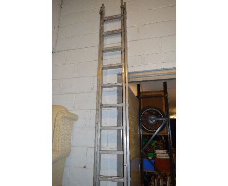 AN ALUMINIUM LADDER, 3.5m long with a ladder step off