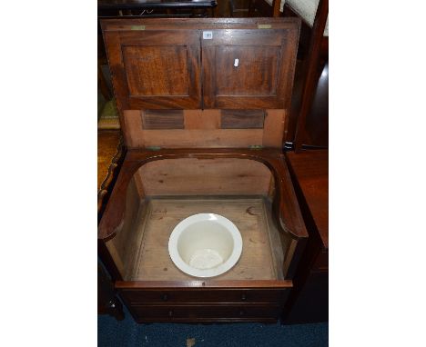 AN EDWARDIAN MAHOGANY COMMODE, in the form of a four drawer two door tallboy