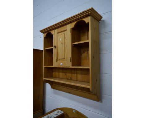 A PINE HANGING BOOKCASE, with single cupboard door and another hanging bookcase with three ceramic drawers (2)