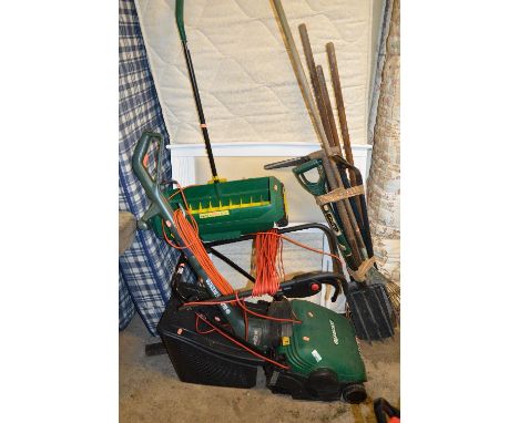 A QUALCAST ELECTRIC LAWN MOWER, with grass box, a Black and Decker strimmer, a lawn seeder and various other garden tools