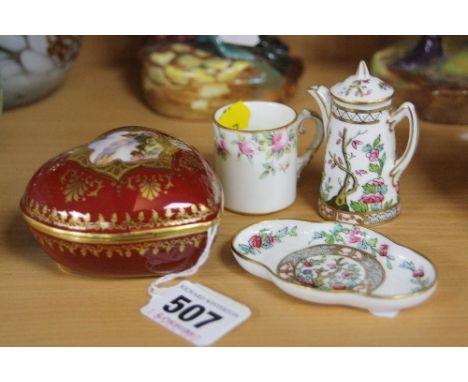 A COALPORT HEART SHAPED COVERED TRINKET DISH, hand painted scenic view insert (chipped lid), together with three miniature Co