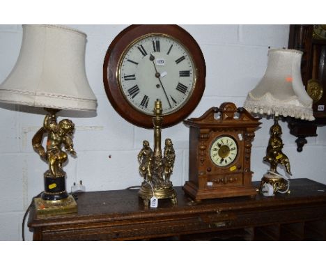 TWO BRASSED TABLE LAMPS, one bearing a cherub and the other a girl with shades and another brassed table lamp (3)