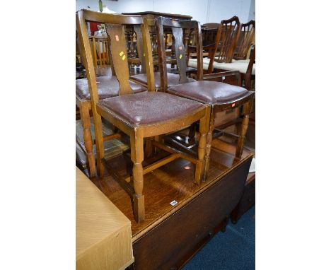 AN OAK BARLEY TWIST GATE LEG TABLE, with pie crust edge and four later chairs