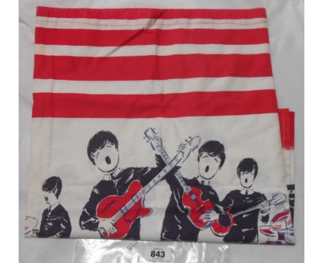 A vintage printed cotton 'scarf' (cut from an original dress) with repeat stylised images of The Beatles performing, within r