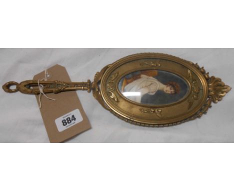 An antique French gilt metal hand mirror with central hand painted portrait on celluloid of a seated maiden - foxing to mirro