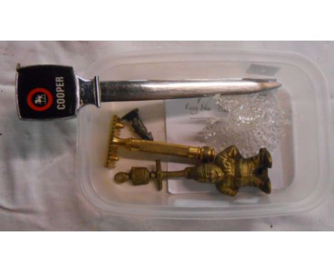 A tub containing a quantity of collectable items including door knocker, letter opener, etc.